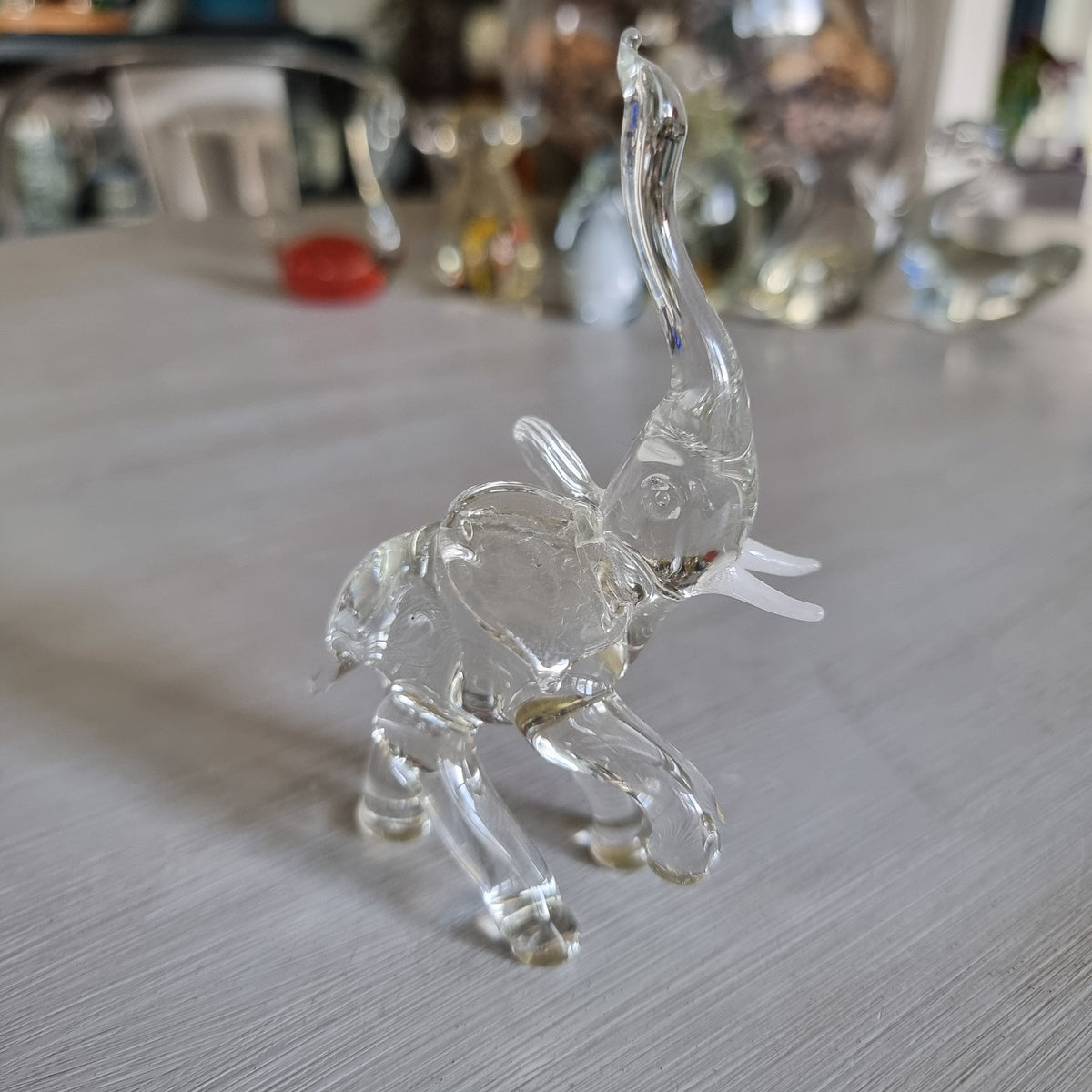 Vintage clear blown glass elephant figurine with trunk raised