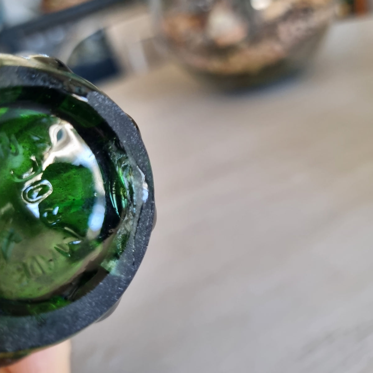 Vintage deep green swung glass vase with ribbed sides and tall pointed rim