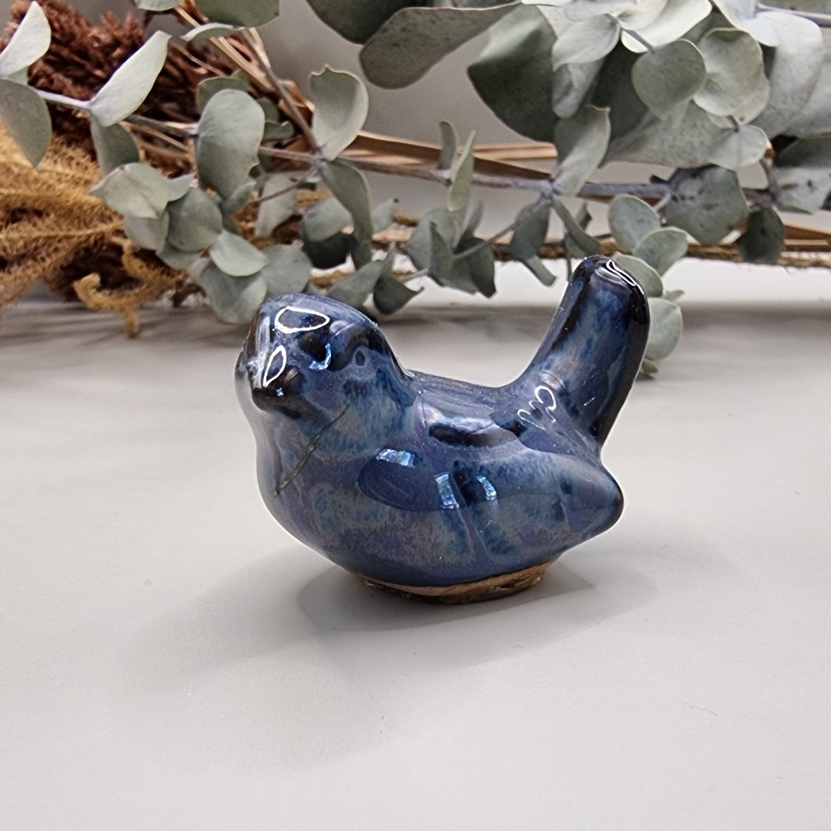 Small hand-painted ceramic blue bird
