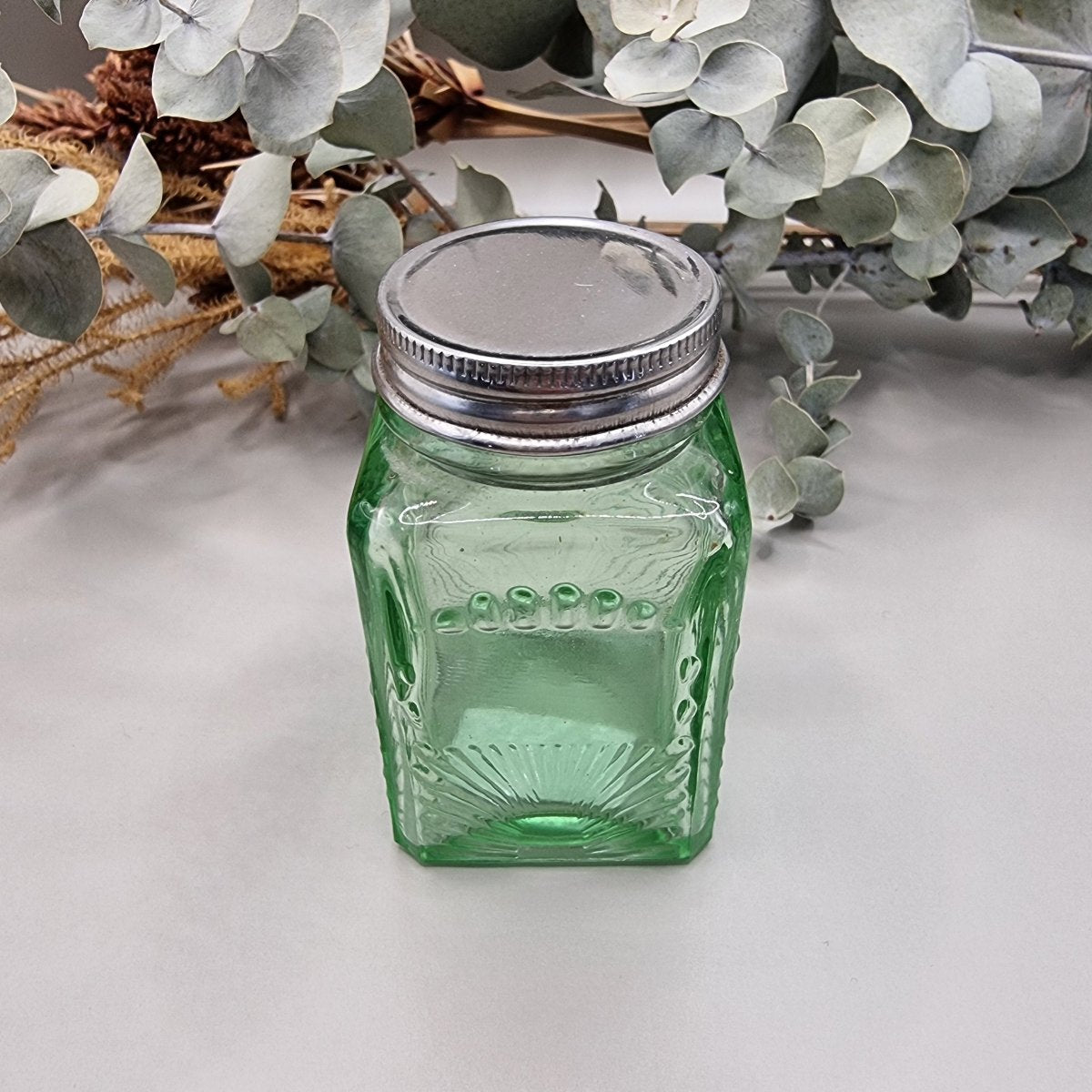 Vintage green glass spice jar