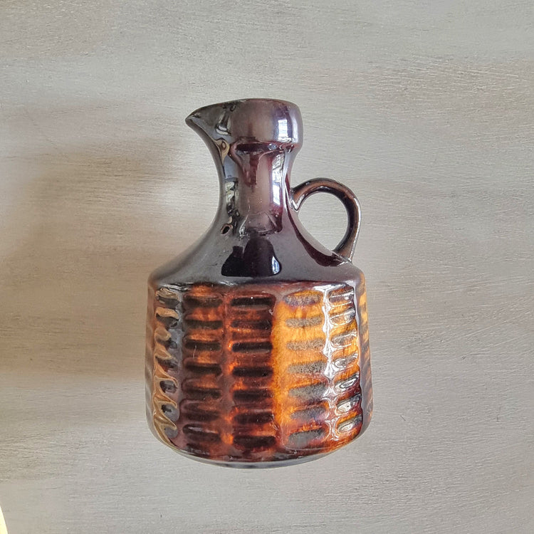 Vintage Crown Lynn jug in rich golden and brown tones