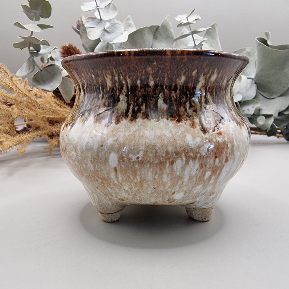 Brown and white glazed footed pot