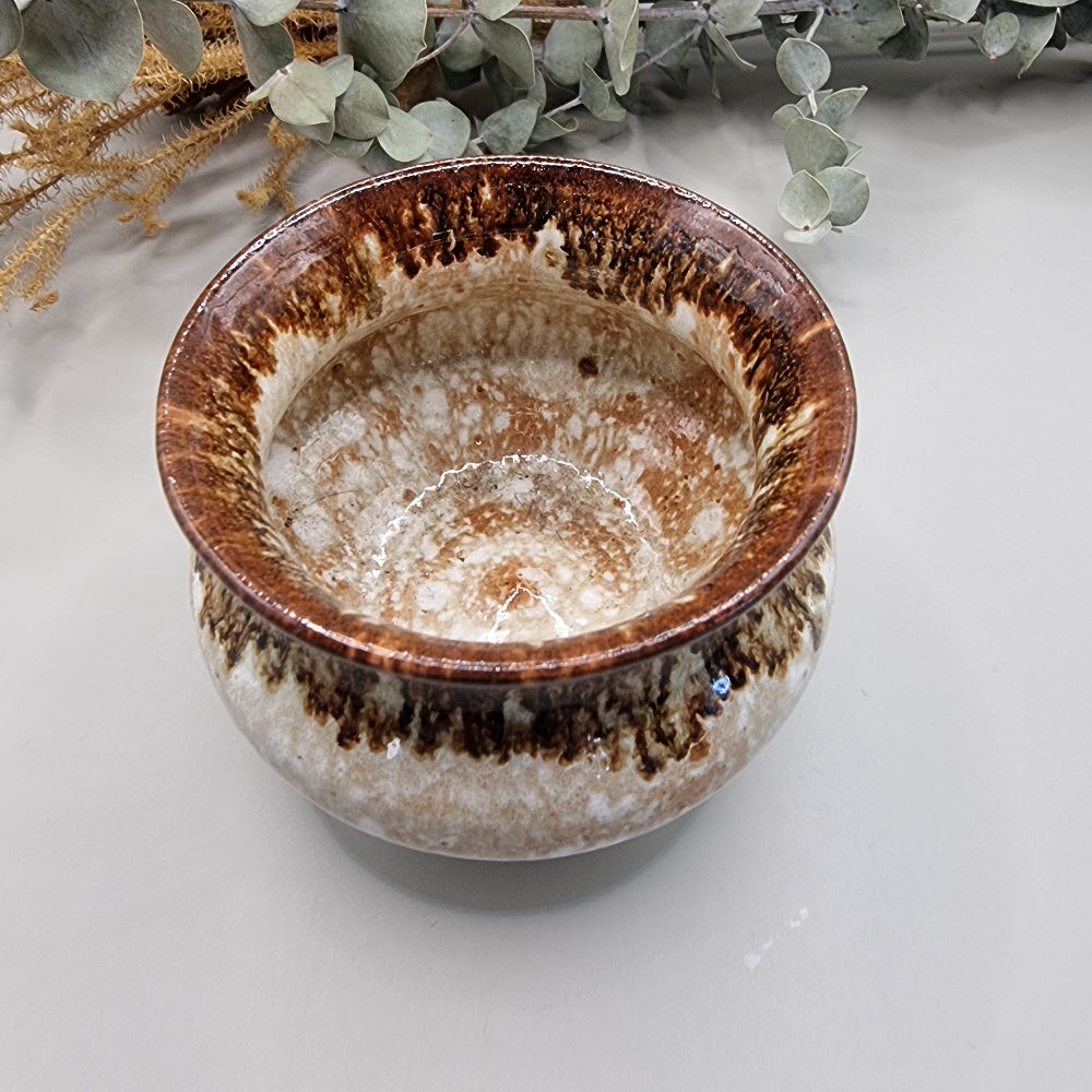 Brown and white glazed footed pot