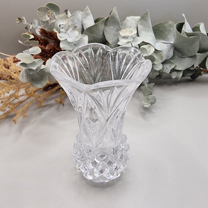 Vintage scalloped cut glass bud vase with flared rim and diamond-cut base.