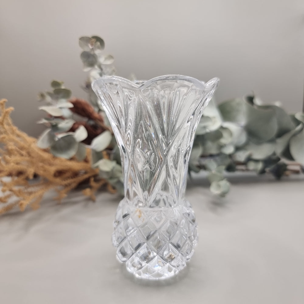 Vintage scalloped cut glass bud vase with flared rim and diamond-cut base.