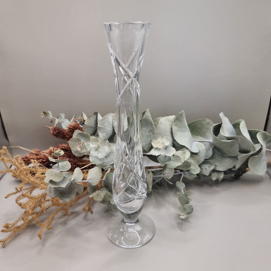 Tall cut crystal bud vase with twisted stem and narrow mouth