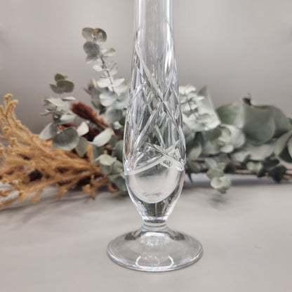 Tall cut crystal bud vase with twisted stem and narrow mouth