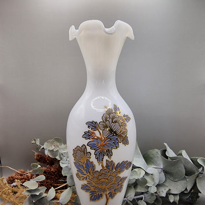 Tall white milk glass vase with gold and blue floral detail and ruffled top