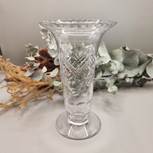 Crystal bud vase with flared rim and crosshatch cut pattern on footed base.
