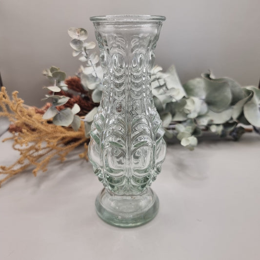 Clear vintage pressed glass vase with ornate baroque-style pattern