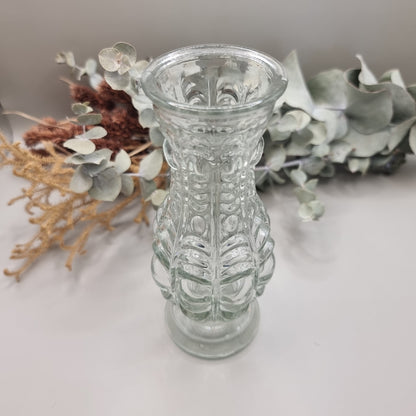 Clear vintage pressed glass vase with ornate baroque-style pattern