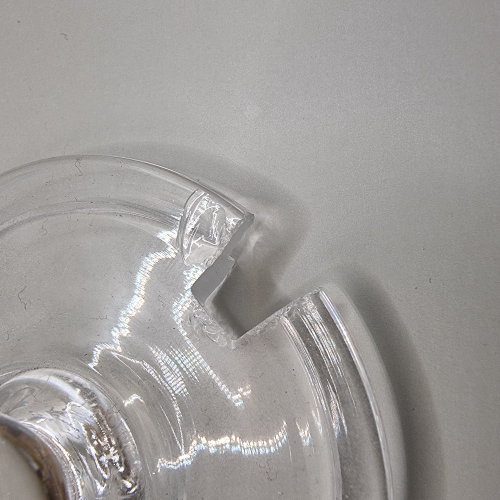 Cut glass sugar or jam jar with lid and spoon, featuring starburst pattern and faceted edge.
