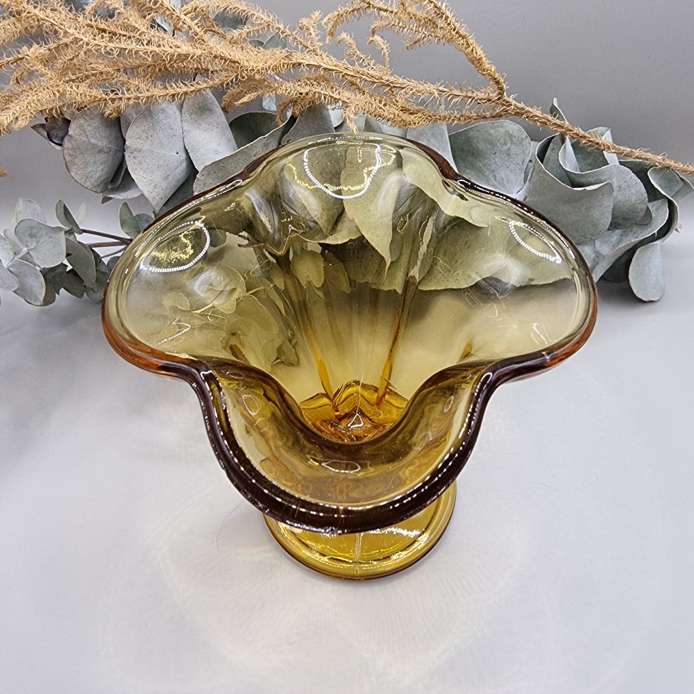 Amber flared glass vase or sundae dish with ribbed sides and footed base.