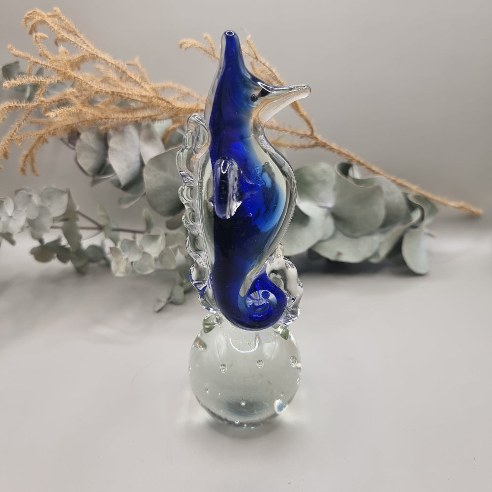 Cobalt blue and clear glass seahorse ornament with bubble-filled base.