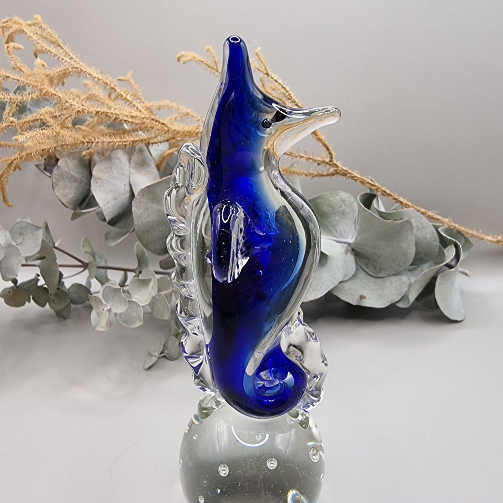 Cobalt blue and clear glass seahorse ornament with bubble-filled base.