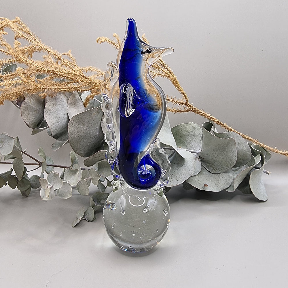 Cobalt blue and clear glass seahorse ornament with bubble-filled base.