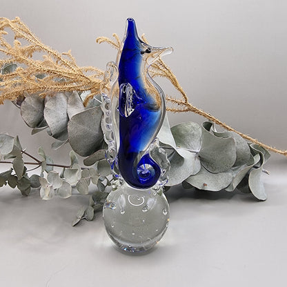 Cobalt blue and clear glass seahorse ornament with bubble-filled base.