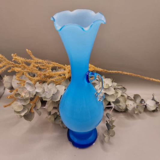 Blue art glass vase with scalloped rim and clear handle, vintage-style ewer shape