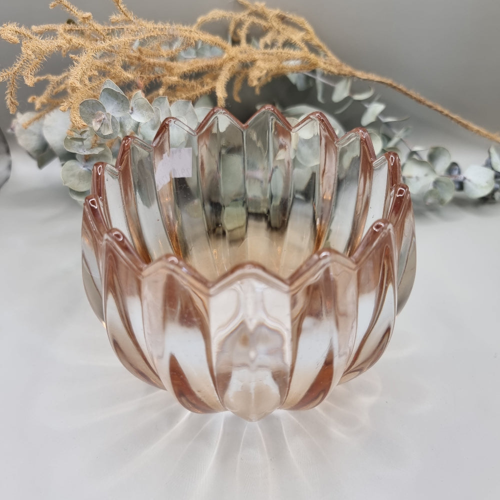 Pair of blush peach scalloped glass tealight holders with petal edge and vertical ridging.