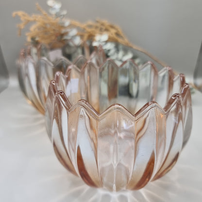 Pair of blush peach scalloped glass tealight holders with petal edge and vertical ridging.