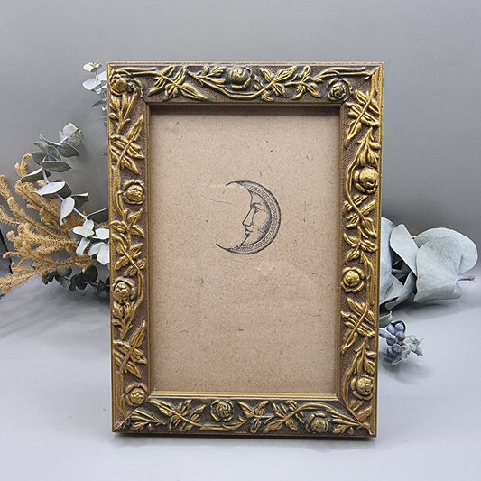 Vintage gold frame with rose pattern