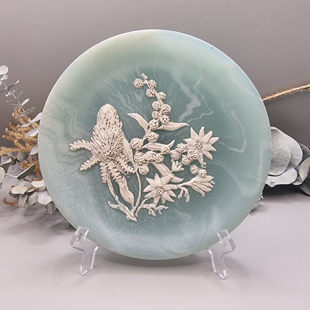 Green marlestone plaque with raised native Australian floral design, made in Australia.