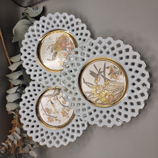 Set of 3 decorative plates with Chokin art birds and flowers, pierced edges and gold trim.