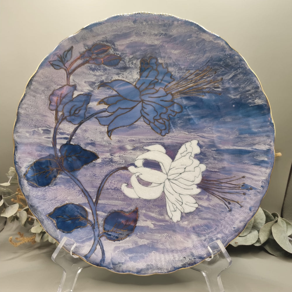 Tirschenreuth Germany floral plate with hand-painted flowers, gold detailing, and purple-blue marbled background.