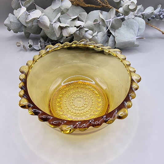 Amber glass bowl with scalloped rim and textured base—perfect for snacks, trinkets or display.