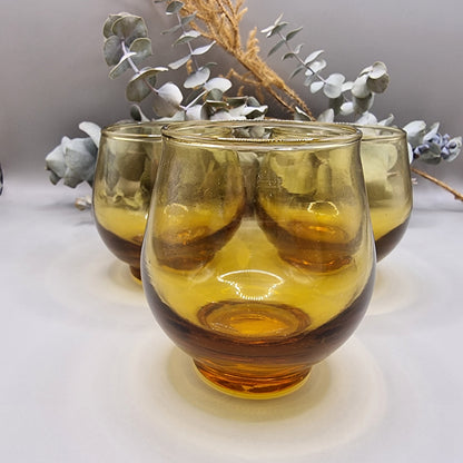 Set of 6 rounded amber glass tumblers, perfect for wine, cocktails, or display.