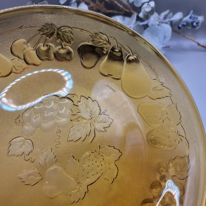 Amber glass serving dish with embossed fruit detail, made in Indonesia.