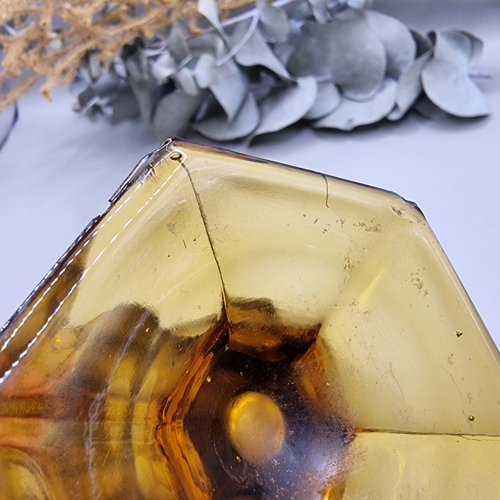 Amber glass with fluted body, scalloped rim and hex base—use as a vase or dessert glass.
