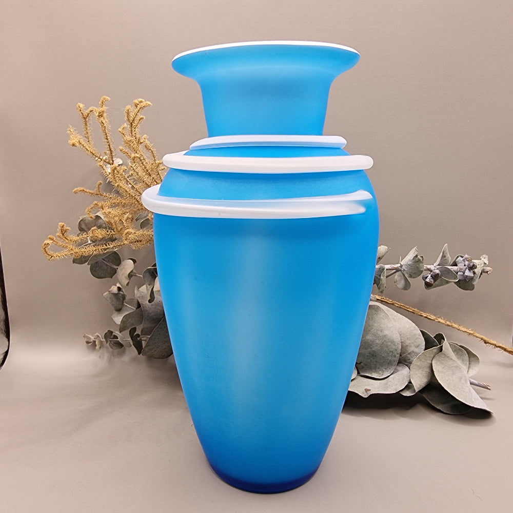 Matte blue glass vase with white banded neck and flared rim, retro art glass design