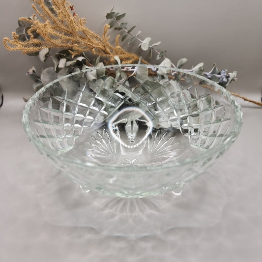 Footed pressed glass bowl with diamond pattern and starburst base.