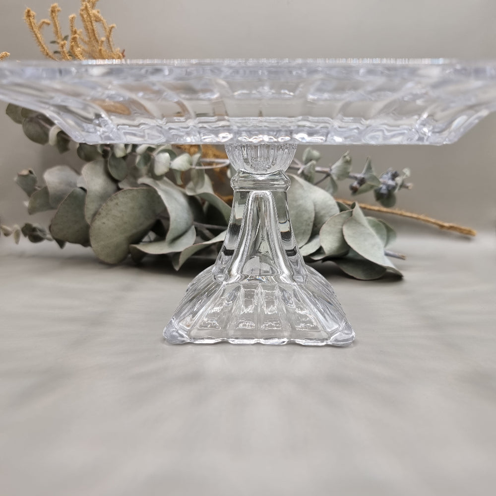 Clear square glass pedestal dish with ribbed edges and raised base