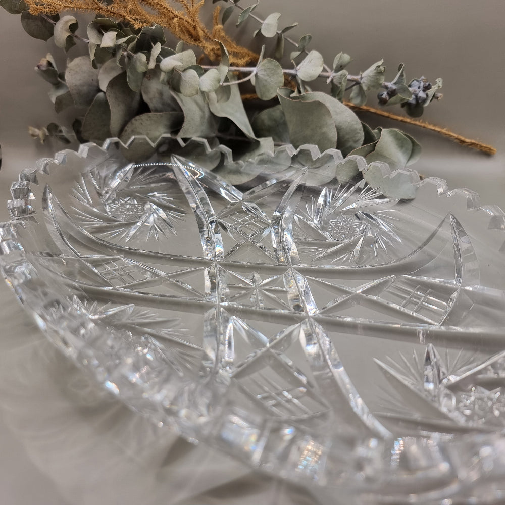 Oval cut glass tray with scalloped edge and intricate pressed pattern