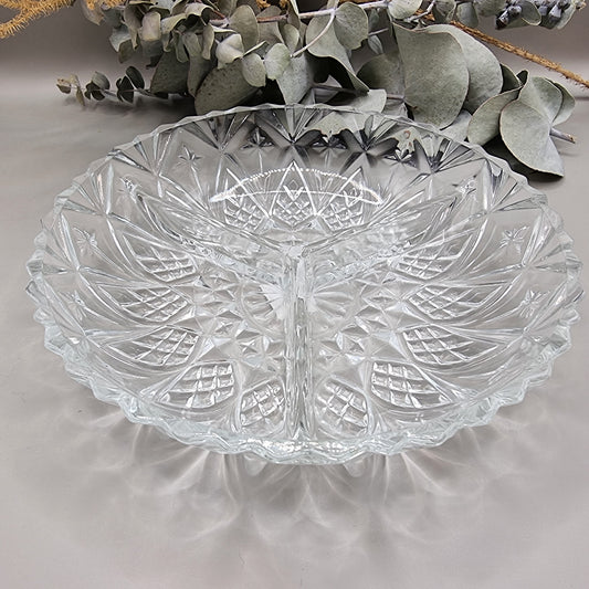 Three-section pressed glass dish with starburst and diamond pattern