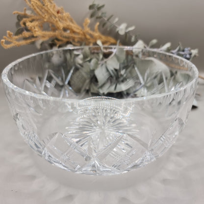 Deep pressed glass bowl with crosshatch pattern and starburst base