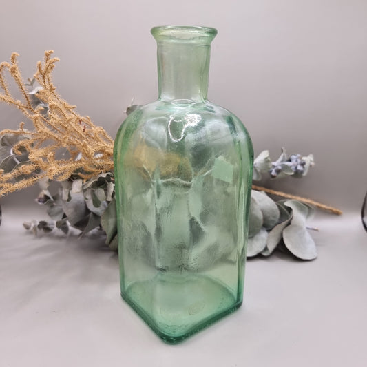 Vintage green glass square bottle with rounded shoulders and pale green tint