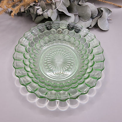 Vintage green pressed glass scalloped dish with sunburst and dot pattern