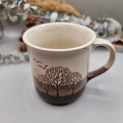 Vintage mug with trees and birds design 