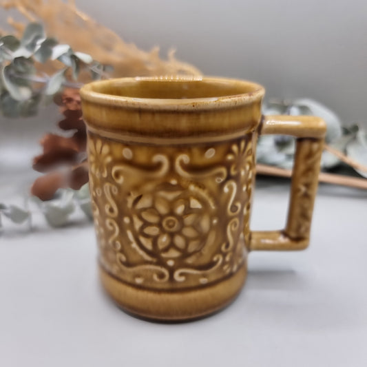 Vintage mug with floral pattern