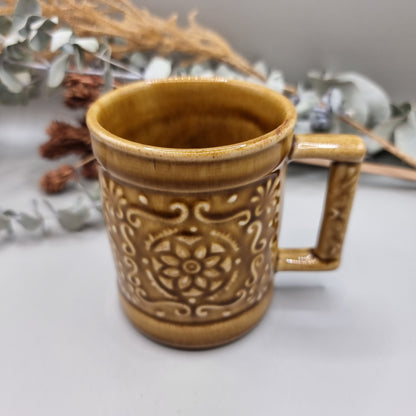 Vintage mug with floral pattern