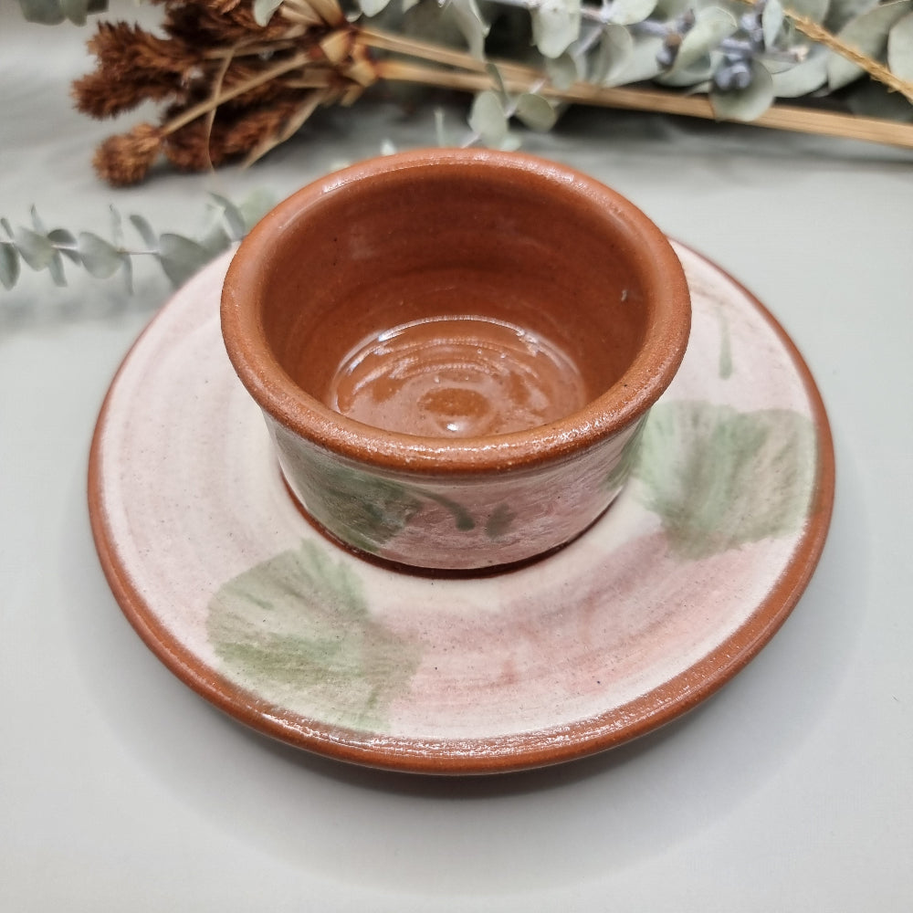 Terracotta serving dish with plate