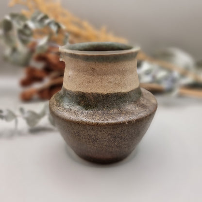 Studio pottery vase in earth tones