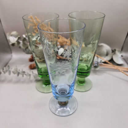 Set of 3 etched glass goblets in green and blue with floral design.