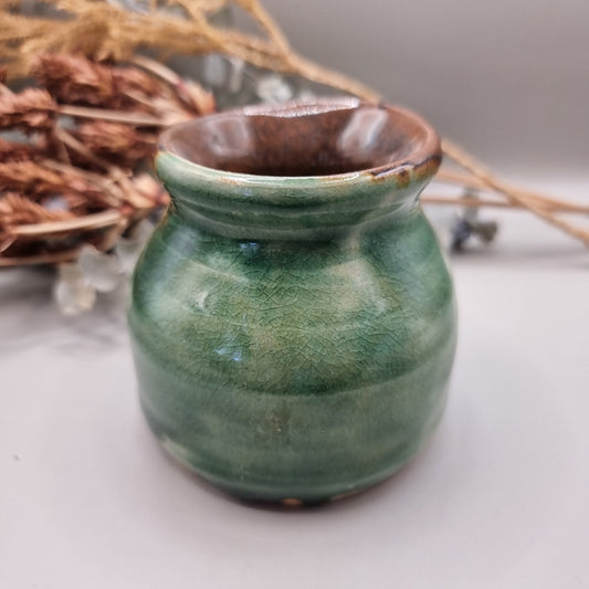 Handmade green pottery pot with crackle glaze and brown rim