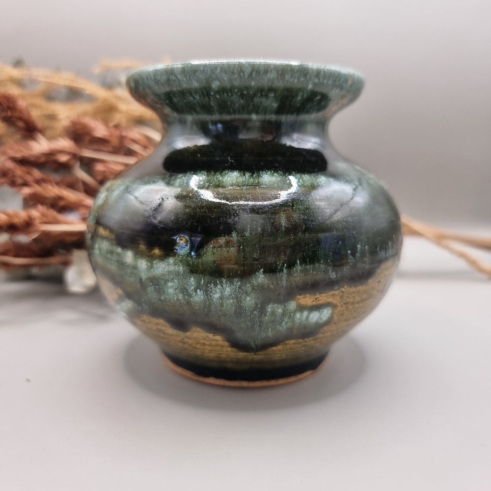 Signed studio pottery vase with glossy green and brown drip glaze finish