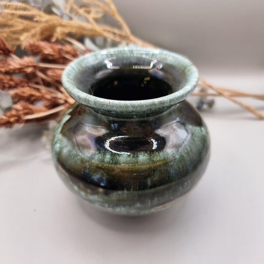 Signed studio pottery vase with glossy green and brown drip glaze finish