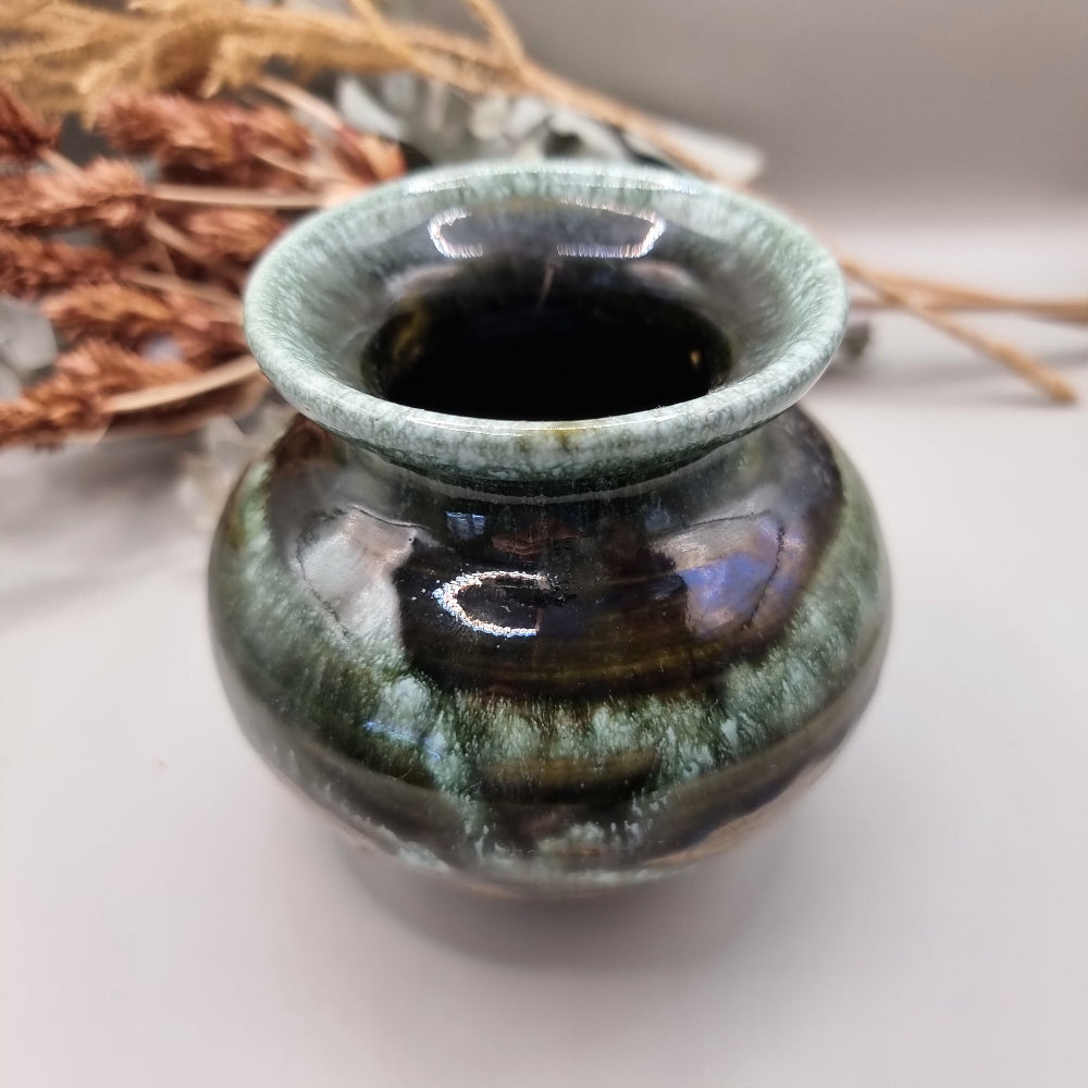 Signed studio pottery vase with glossy green and brown drip glaze finish